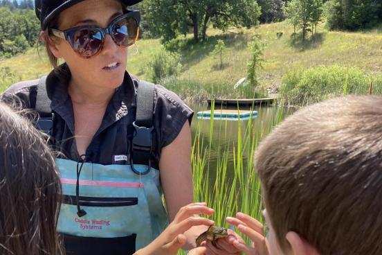 Beth Sabo showing bullrog to campers