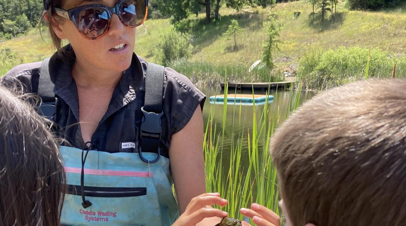 Beth Sabo showing bullrog to campers