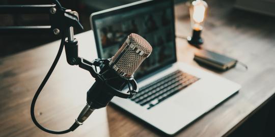 Stock image of microphone & podcast recording set up